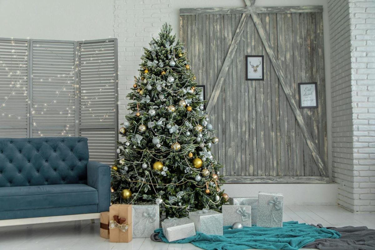 A beautifully decorated living room with a Christmas tree and gifts, creating a festive holiday atmosphere.